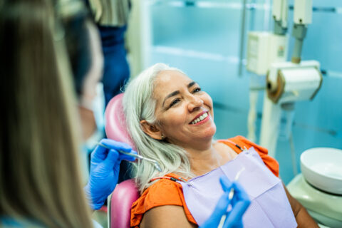 Woman having teeth examined by a dentist