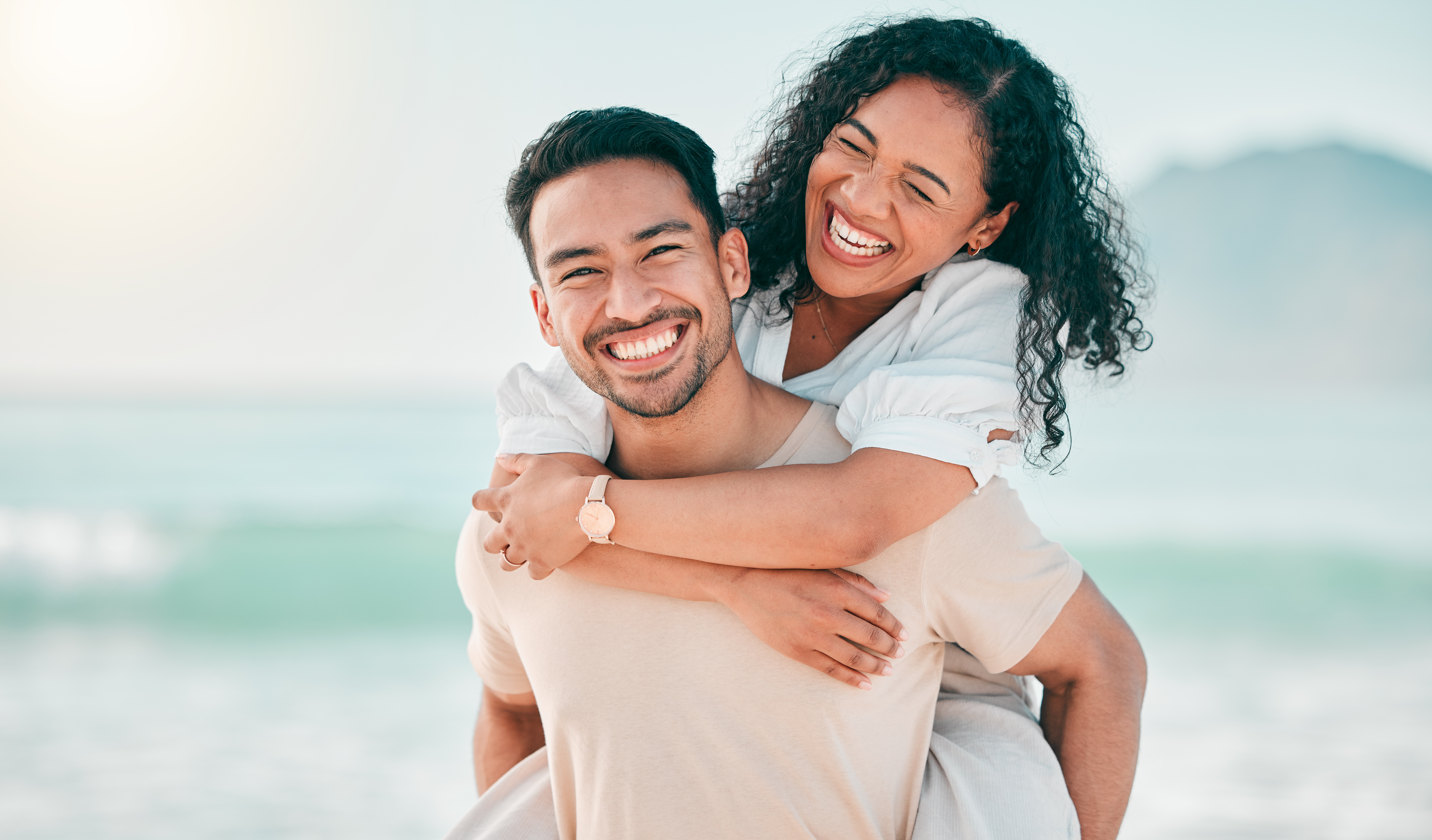 Couple on the beach smiling