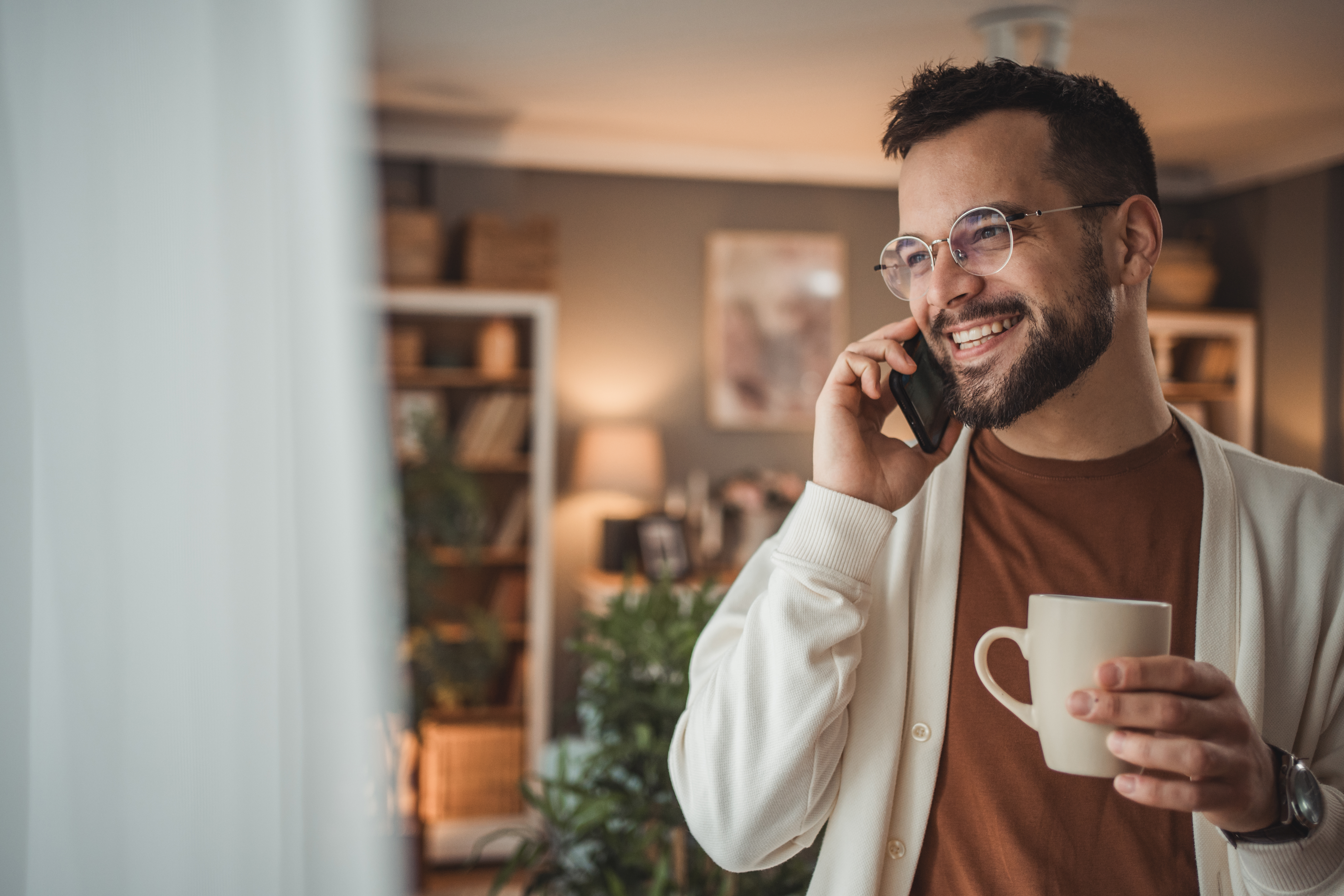 Man with cup of coffee in hand